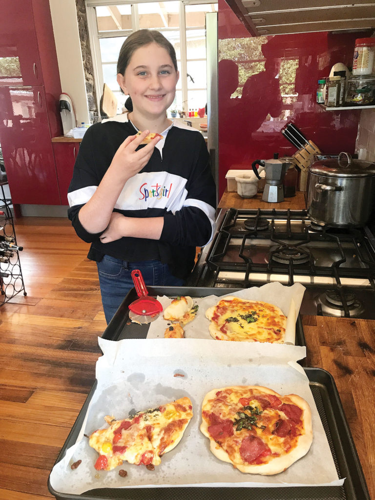 Eva Cooking A Pizza