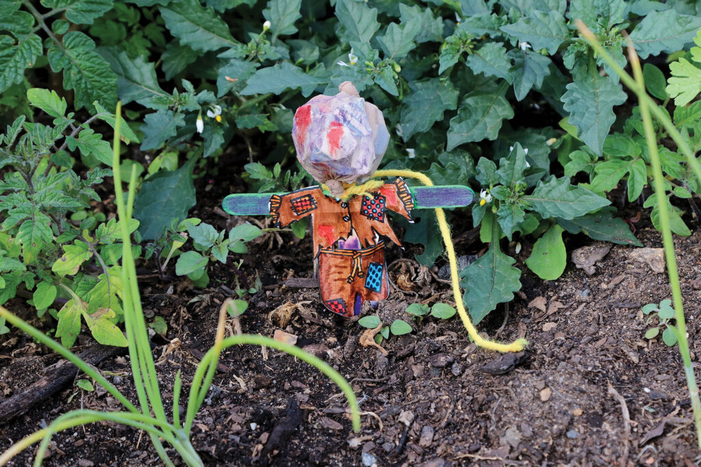 Tash assisting Eli, Izack & Zoe making scarecrows  for the Yarrabilba Community Garden DIY Scarecrows Project