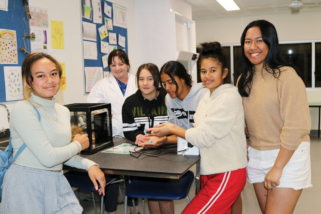 Students and a teacher and in the biology room 