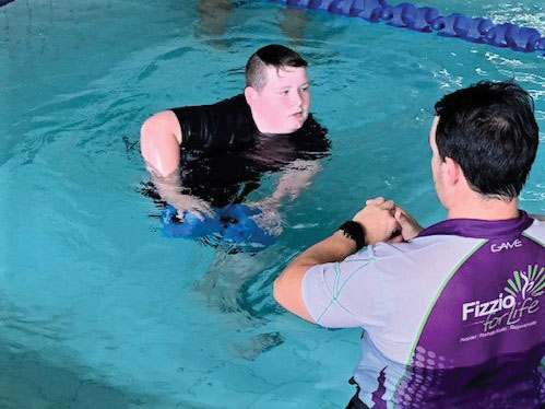 Dyllan taking part in hydrotherapy