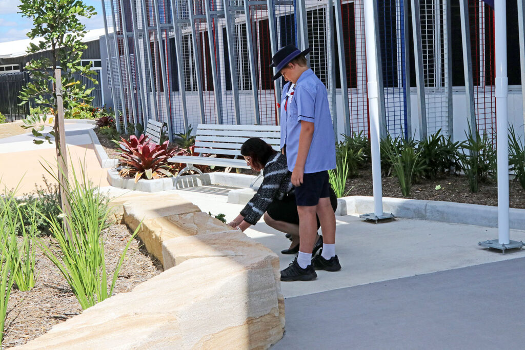 Principal Mrs Belinda Tregea laying a wreath