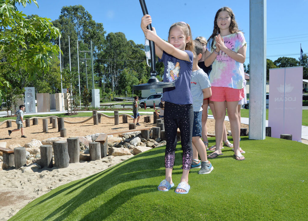 Children Enjoying New Village Green Playground