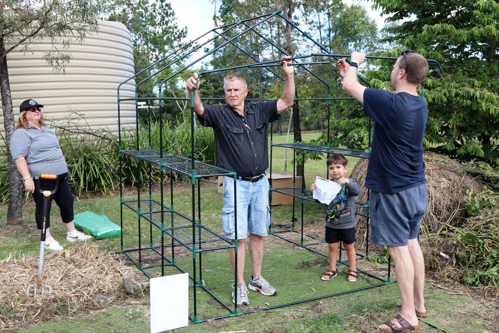 Building a greenhouse at the Gardens on Volunteers Day