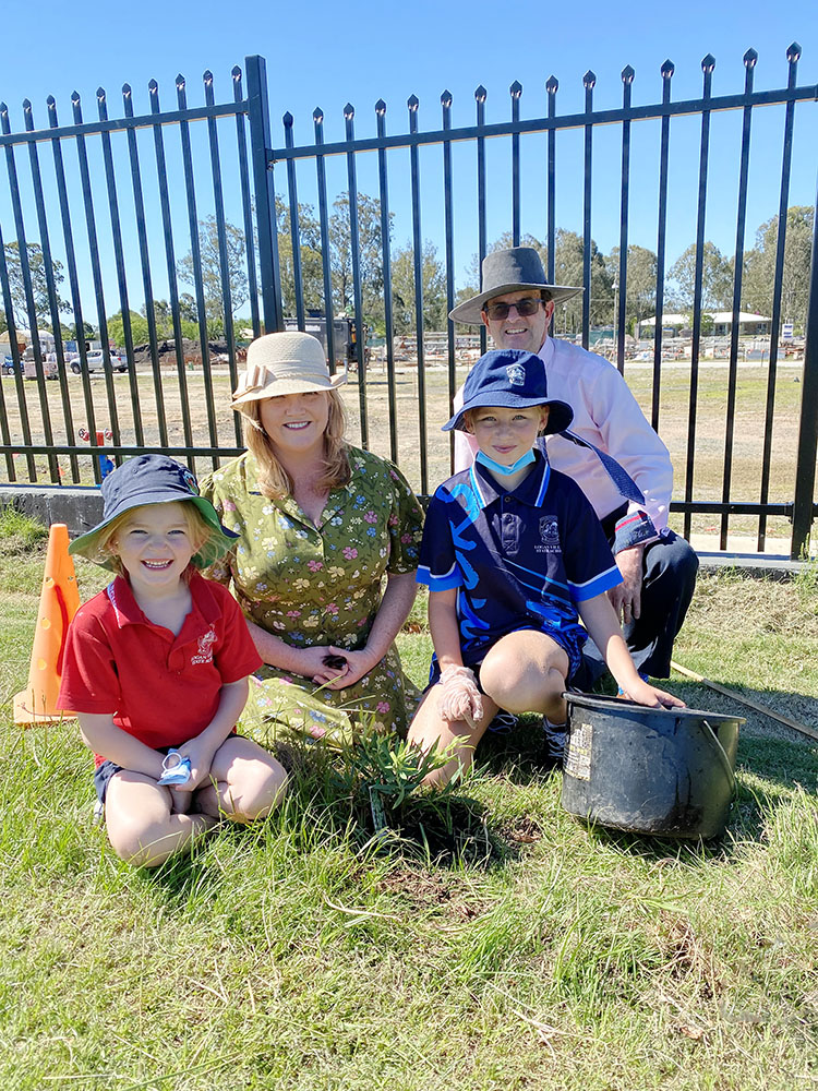 Cr Laurie Koranski & Principal David Cramb planting native trees with students