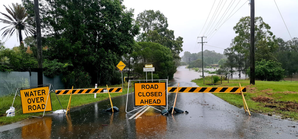 Parts of the City of Logan, including Easterly St, Waterford, are cut-off by floodwaters.