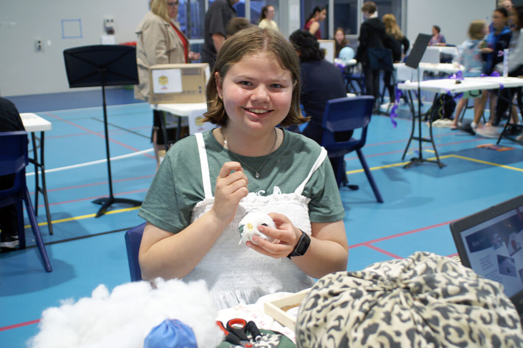 Zoe with her business, Big Hearted Blobs handsewn squishy stress balls