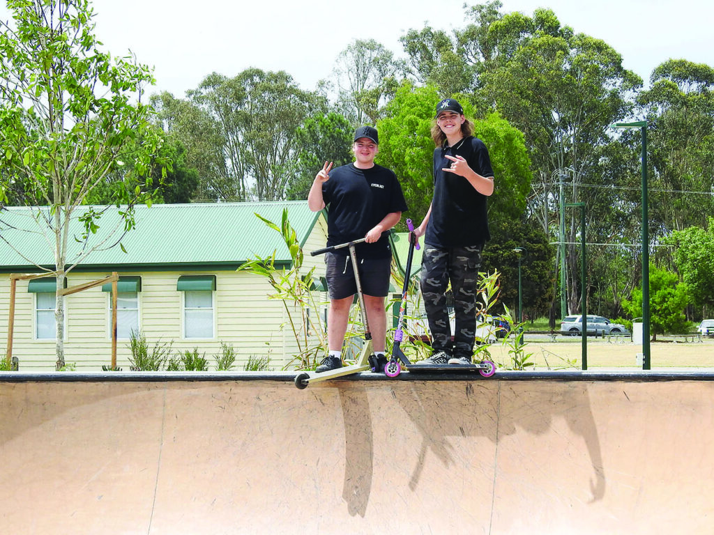 Chase & Taylen enjoying the new skate park at Logan Village before its opening