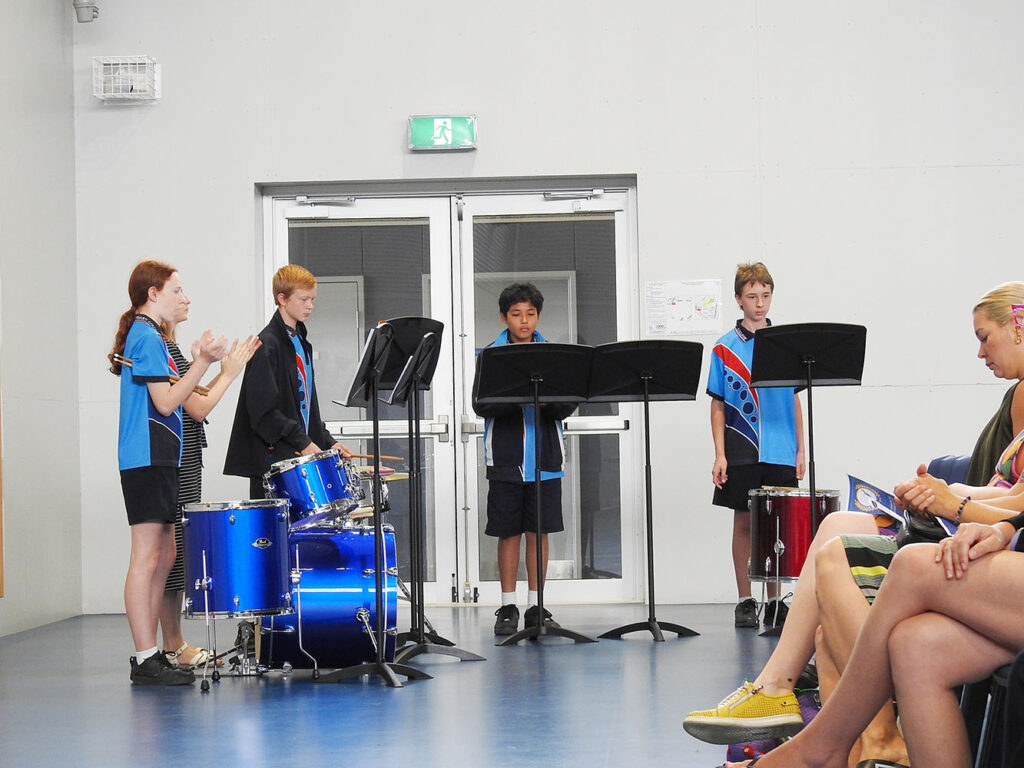 The percussion group playing Hit It